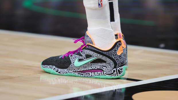 View of Kevin Durant's black and green Nike shoes.